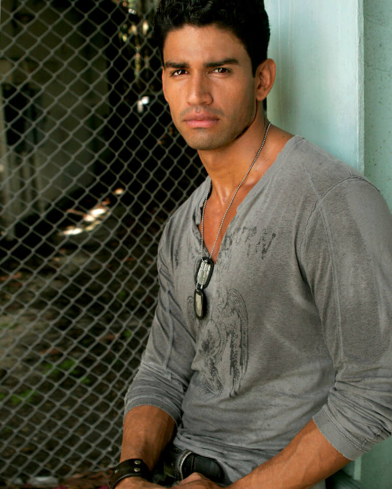 Christian Lopez in a vneck henley