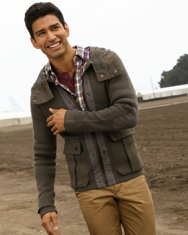 Christian Lopez smiling and walking outside