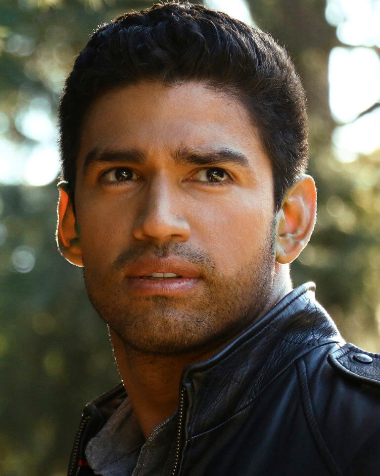 Christian Lopez Headshot in leather jacket